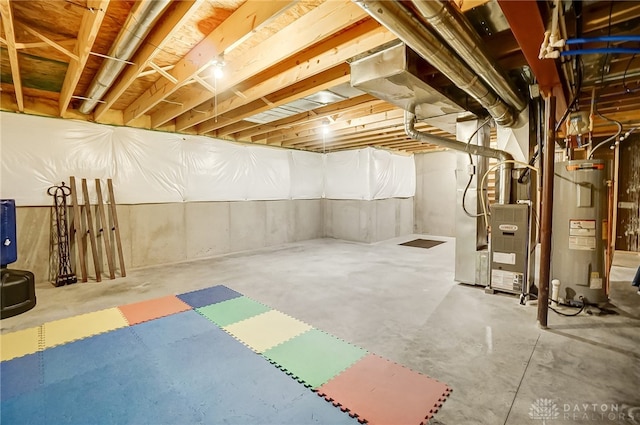 basement with heating unit and water heater