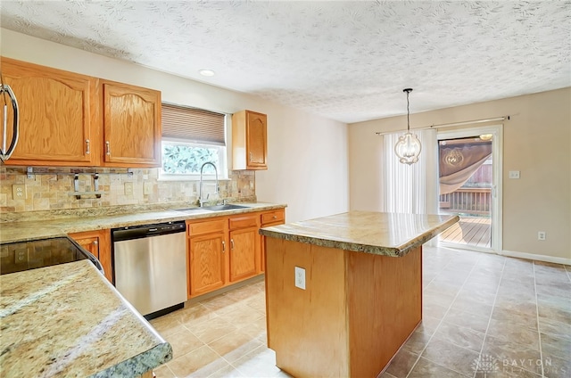 kitchen with dishwasher, a center island, hanging light fixtures, sink, and decorative backsplash