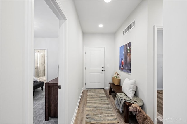 corridor featuring hardwood / wood-style floors