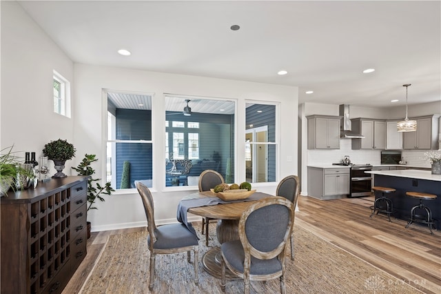 dining space with light wood-type flooring