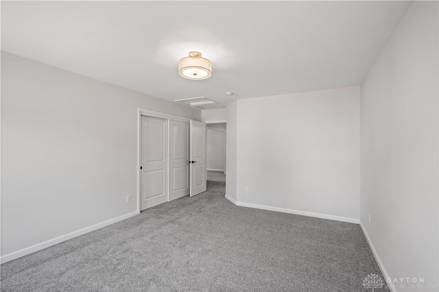 unfurnished bedroom with carpet flooring and a closet