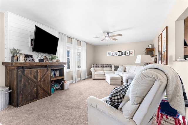 carpeted living room featuring ceiling fan