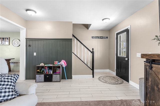 foyer entrance with light wood-type flooring