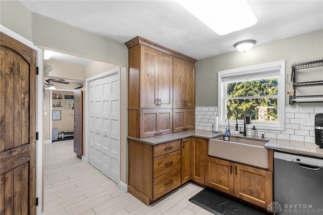 kitchen with ceiling fan, backsplash, sink, and dishwasher