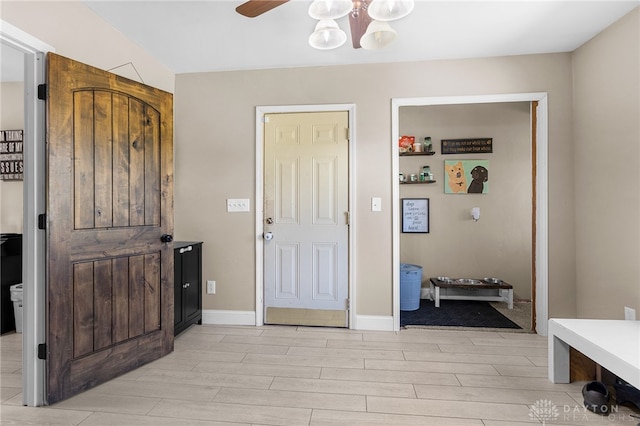 entrance foyer with ceiling fan