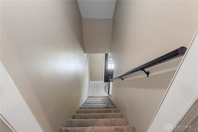 stairs featuring a high ceiling