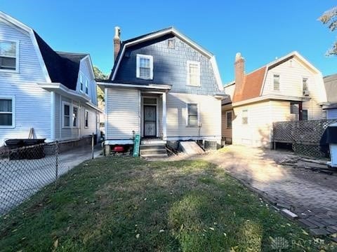 back of house featuring a yard