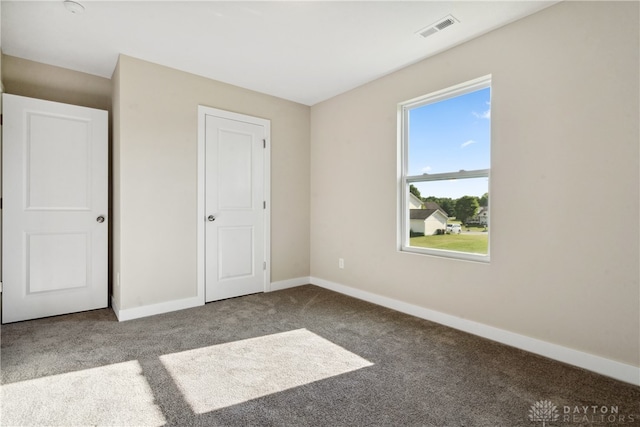 unfurnished bedroom featuring carpet flooring