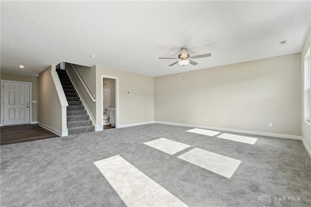 carpeted empty room featuring ceiling fan