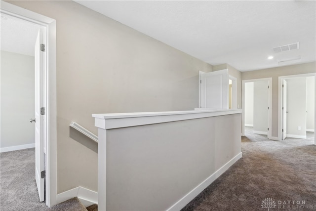 corridor featuring carpet flooring