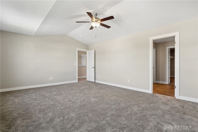 carpeted empty room with lofted ceiling and ceiling fan