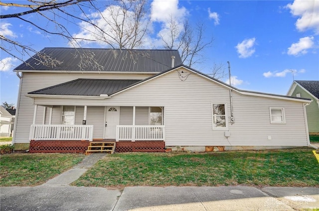 view of front of home with covered porch and a front yard