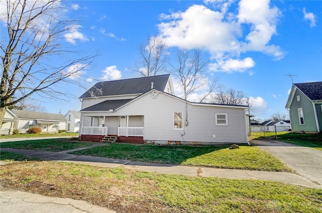 exterior space featuring a porch and a front lawn