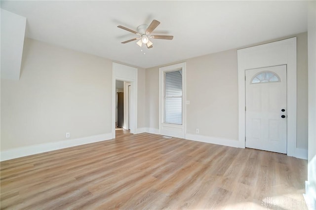 entryway with ceiling fan and light hardwood / wood-style floors