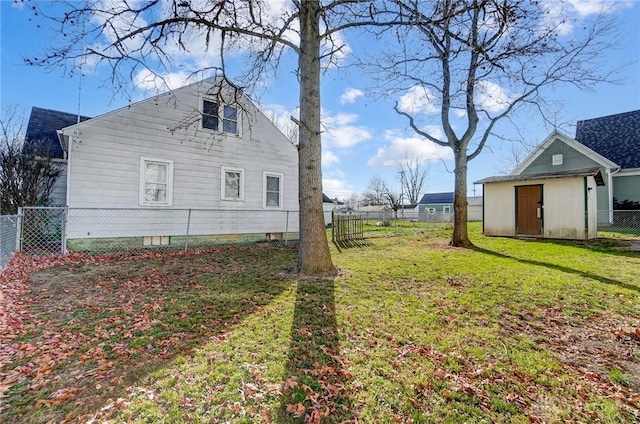 view of property exterior with an outbuilding and a lawn