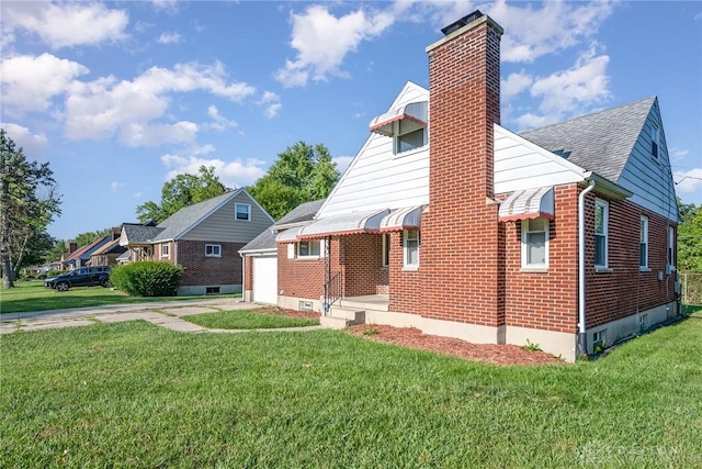 view of front of property with a garage and a front yard