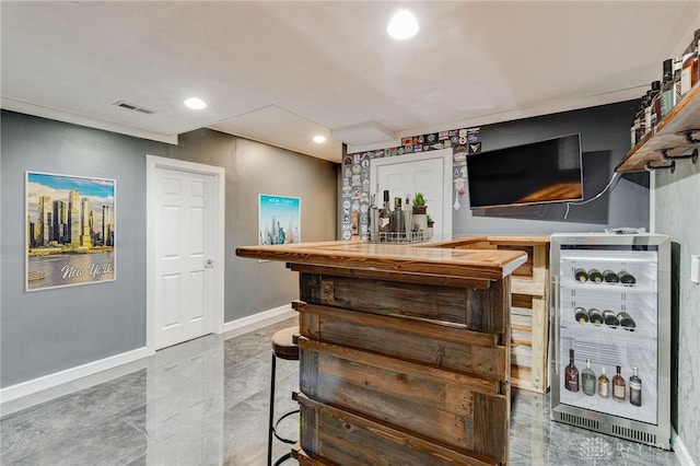 bar with wine cooler and tile patterned flooring