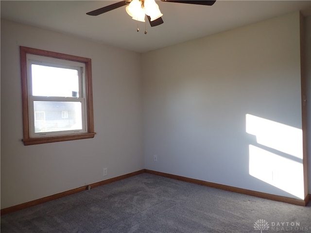 empty room with carpet and ceiling fan