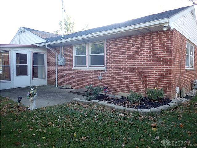 view of home's exterior with a patio area