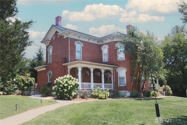 italianate home with covered porch and a front yard