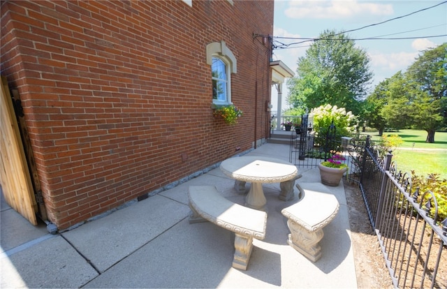 view of side of home featuring a patio