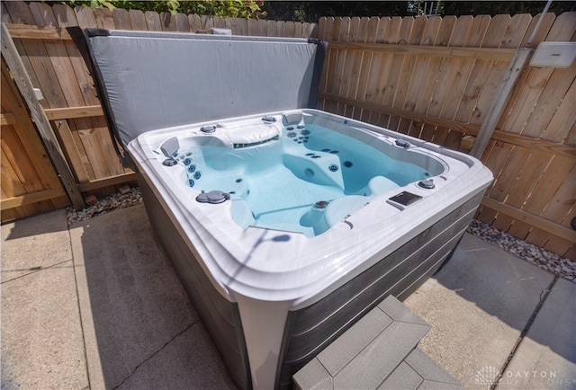 exterior space featuring a hot tub