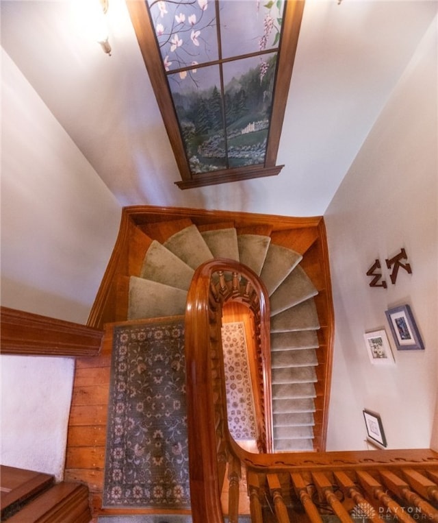 stairs featuring wood-type flooring