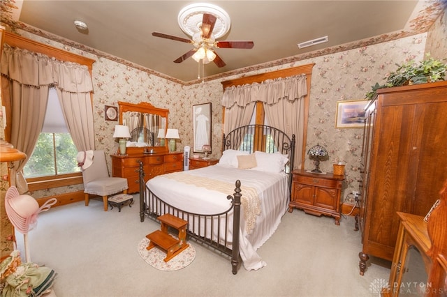 bedroom featuring ceiling fan and light colored carpet