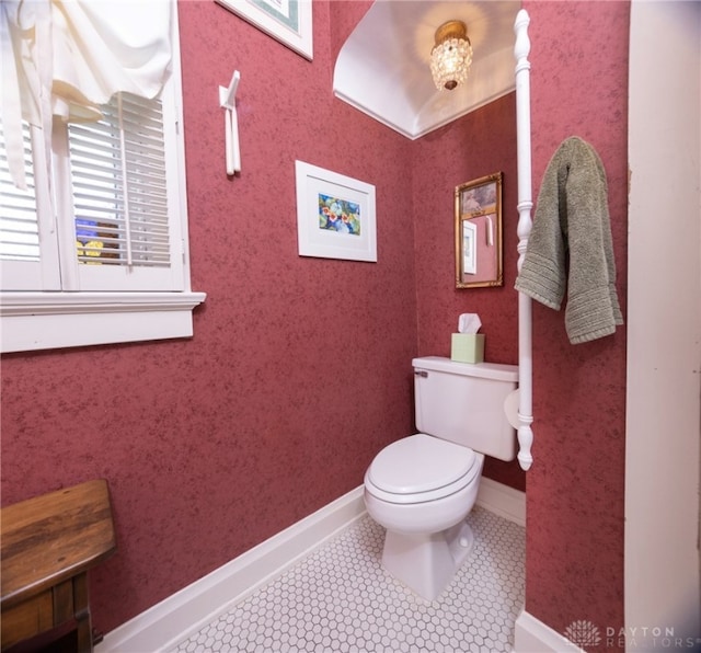 bathroom featuring tile patterned floors and toilet