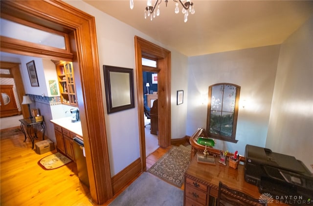 bathroom with a notable chandelier and wood-type flooring