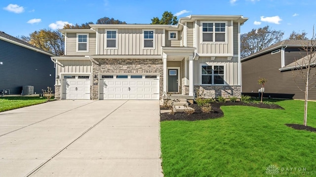 view of front of house featuring central air condition unit, a front lawn, and a garage