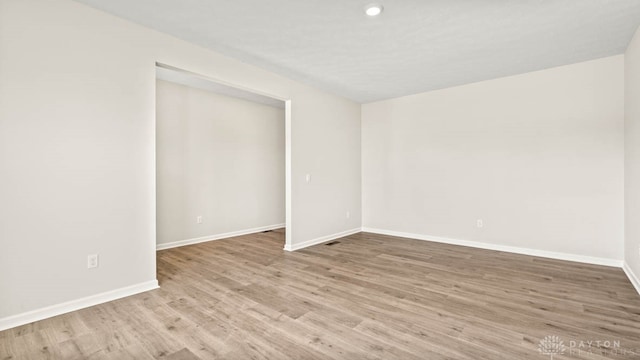 unfurnished room featuring light wood-type flooring