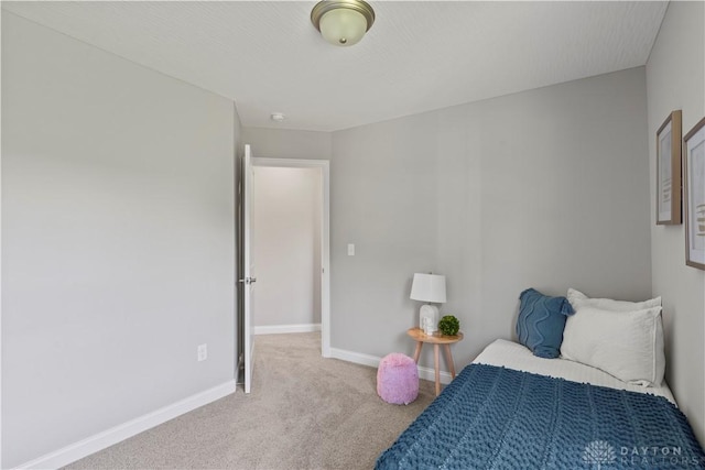 bedroom with light colored carpet