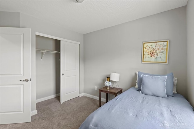 carpeted bedroom featuring a closet