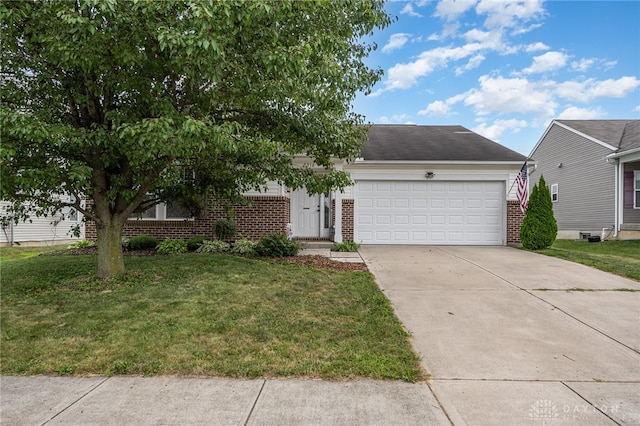 view of front of house with a garage and a front yard