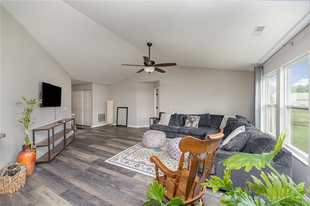 living room with ceiling fan, vaulted ceiling, and dark hardwood / wood-style flooring