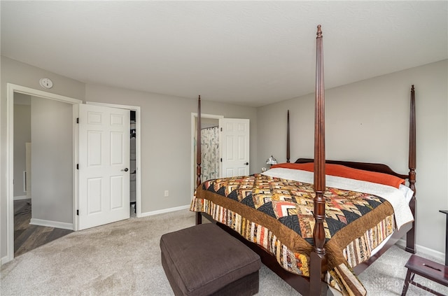 carpeted bedroom with ensuite bath