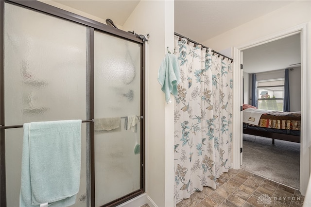 bathroom featuring a shower with door and tile patterned floors