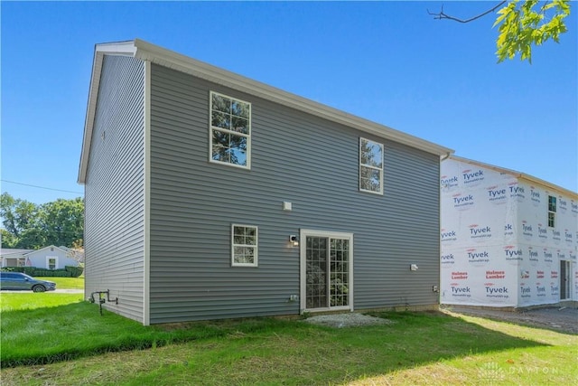 rear view of house with a lawn