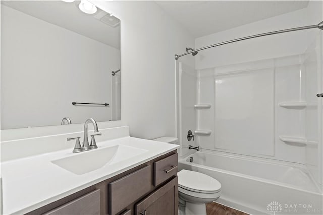 full bathroom with wood-type flooring, bathtub / shower combination, toilet, and vanity