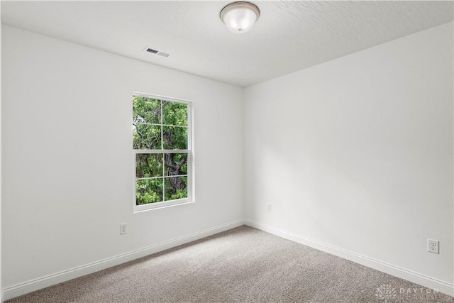 empty room featuring carpet flooring