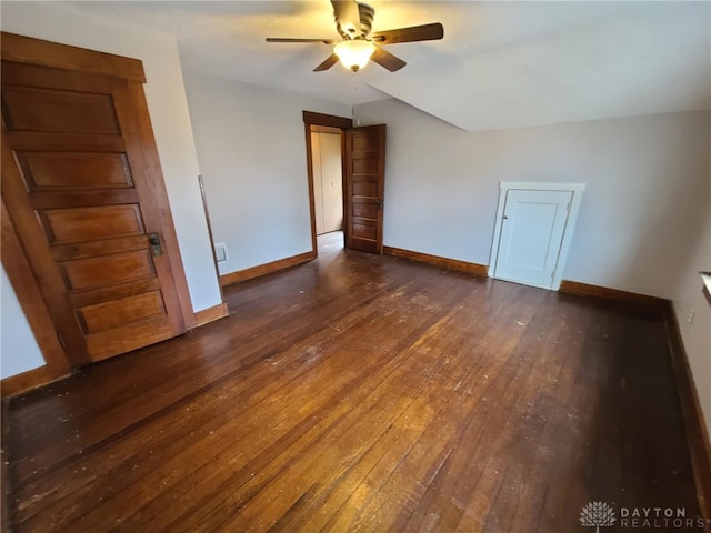 spare room with ceiling fan and dark hardwood / wood-style flooring