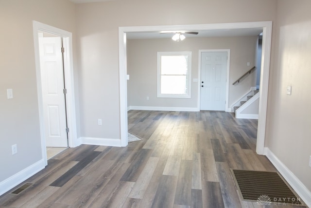 entrance foyer with ceiling fan and wood-type flooring