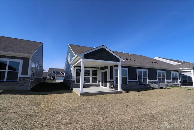 back of property featuring a patio area