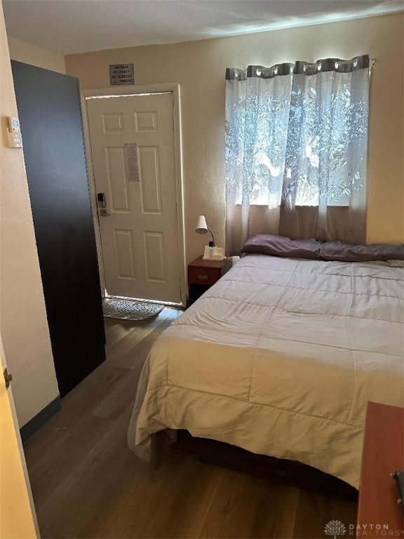 bedroom with hardwood / wood-style flooring