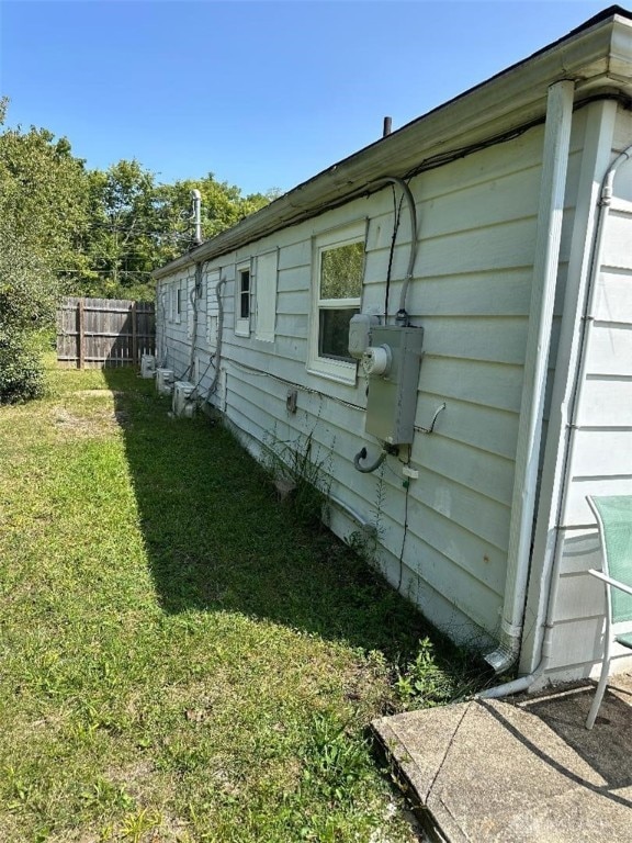 view of home's exterior with a yard