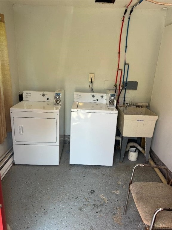 laundry room with washer and clothes dryer and sink