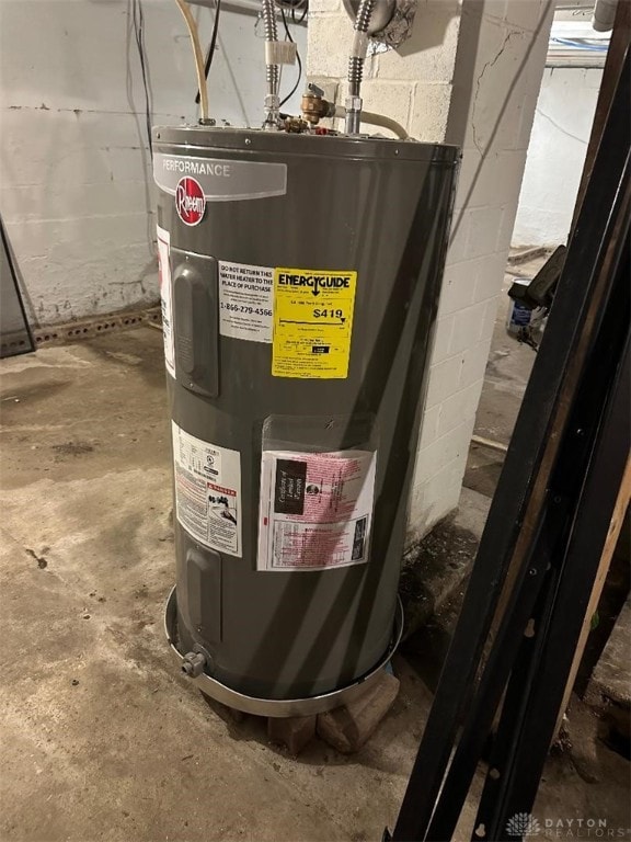 utility room with electric water heater