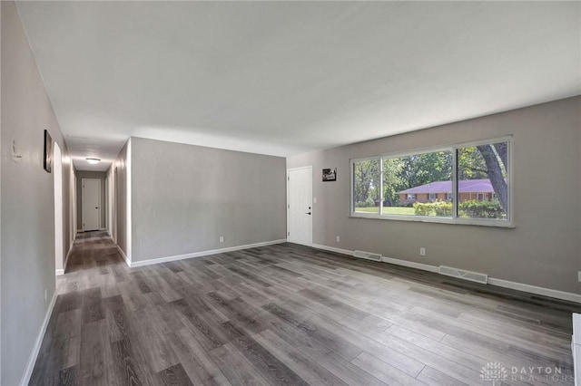 unfurnished room featuring hardwood / wood-style floors