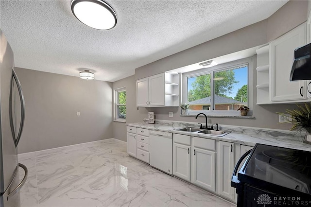 kitchen with white cabinetry, white dishwasher, and sink